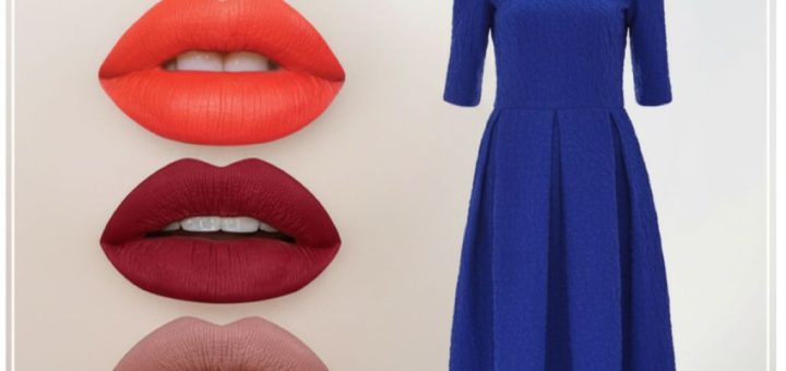 Woman in a royal blue dress applying bold red lipstick in a mirror, showcasing a glamorous makeup look