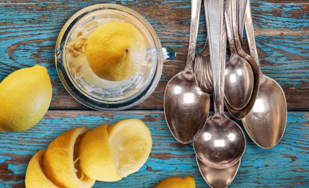 Vintage silver urns restored using eco-friendly lemon juice and hot water soak