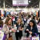 Women shopping at vendor booths and collecting free samples at the New Jersey Women's Expo 2026 inside the New Jersey Expo Center in Edison